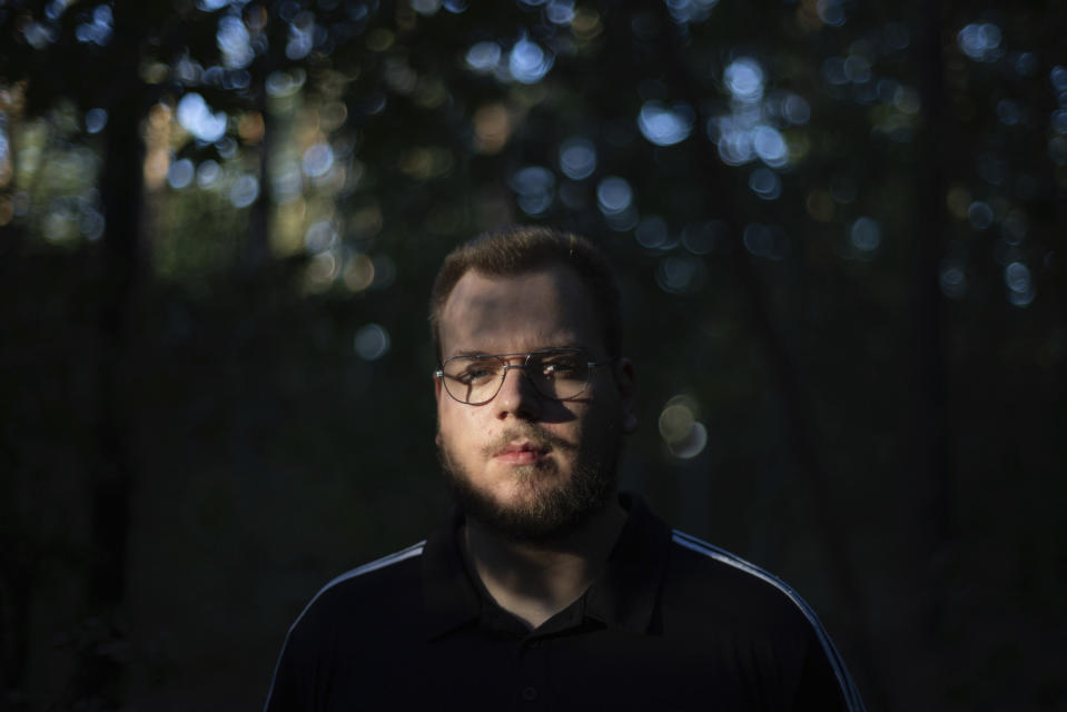 Mateusz Chudzicki, 24, poses for a picture in Pabianice, Poland, Thursday, Sept. 28, 2023. Chudzicki and several other Poles who formally left the church told the AP that what they considered “hypocrisy” and closeness to the government were factors in their decision. (AP Photo/Michal Dyjuk)