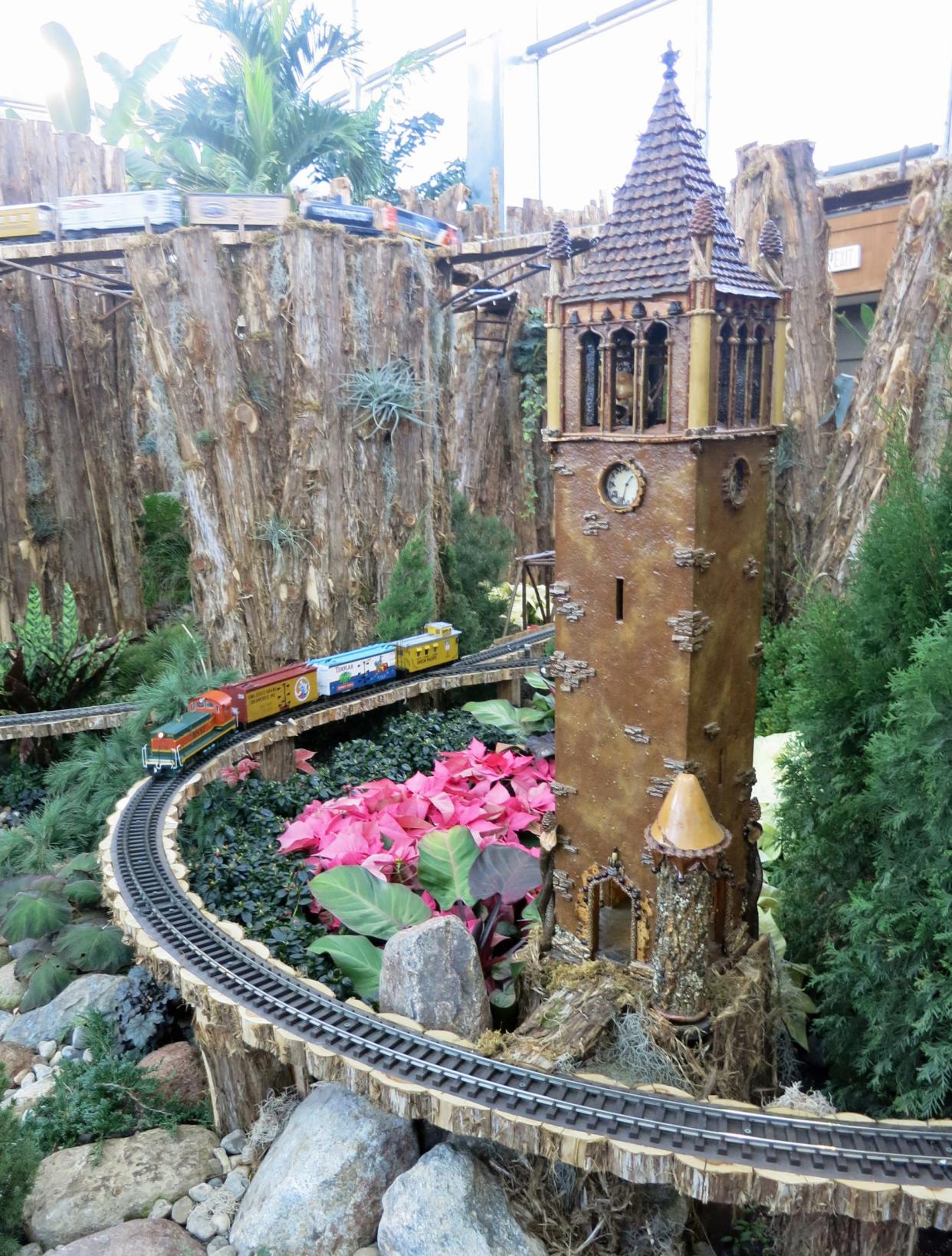 The RG Express rolls around the bend near the Campanile in Reiman Garden's holiday display in 2016.