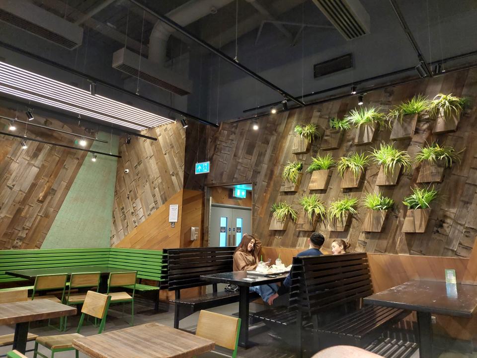 The interior & dining area of a Shake Shack restaurant in London