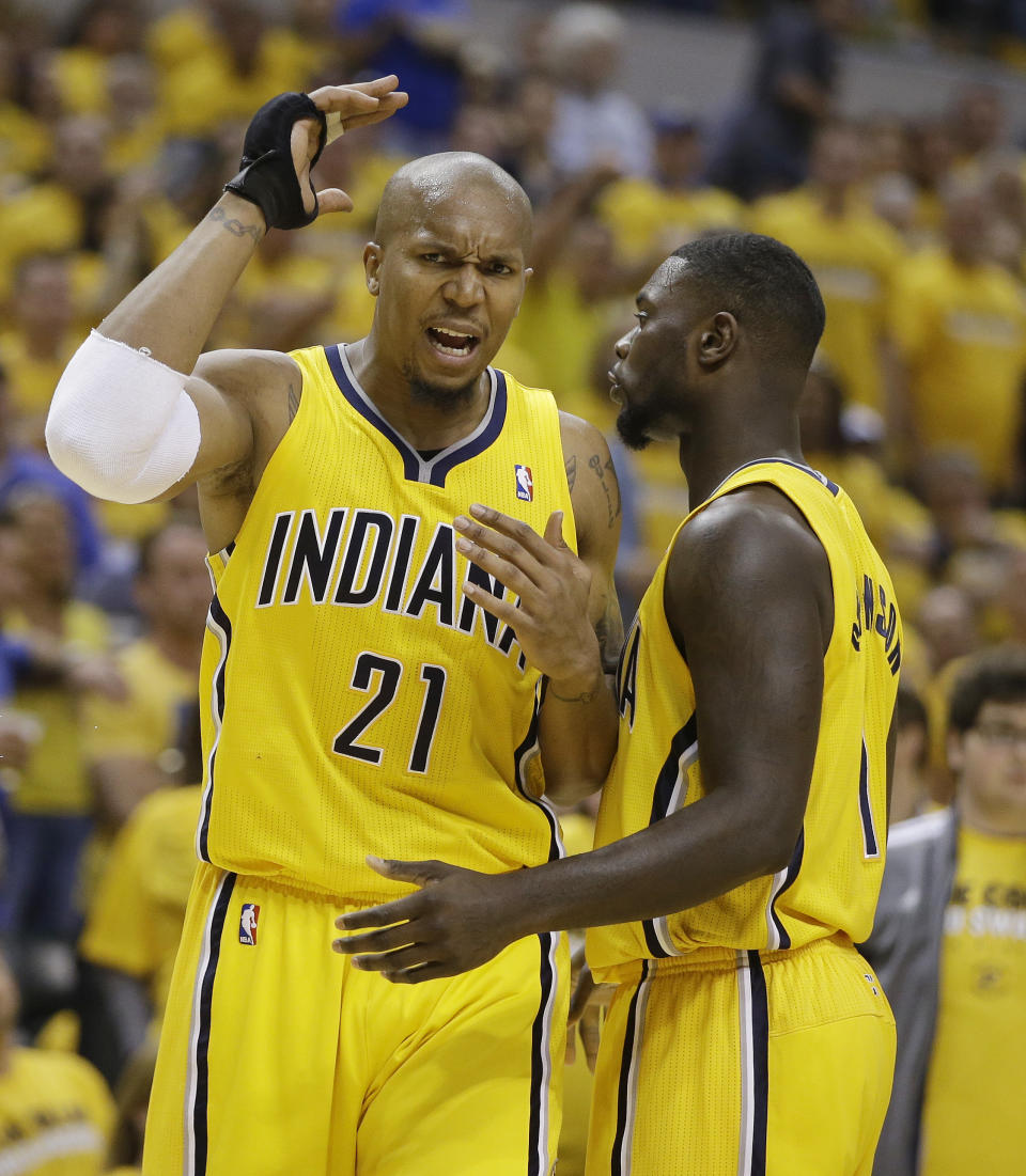 Indiana Pacers' Lance Stephenson (1) talks with David West (21) after West and Atlanta Hawks' Pero Antic had words during the second half in Game 1 of an opening-round NBA basketball playoff series on Saturday, April 19, 2014, in Indianapolis. Atlanta defeated Indiana 101-93. (AP Photo/Darron Cummings)