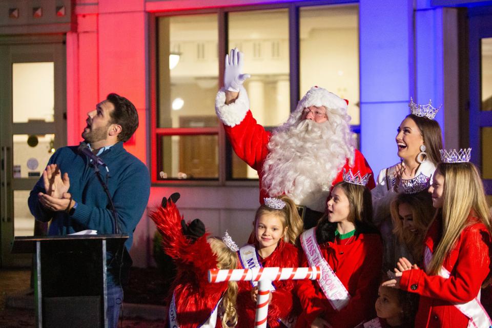 Mayor Scott Conger, Santa Claus and winners of different pageants celebrate as the Christmas Tree is lit in front of city hall on Monday, December 12, 2022, in Jackson, Tenn. 