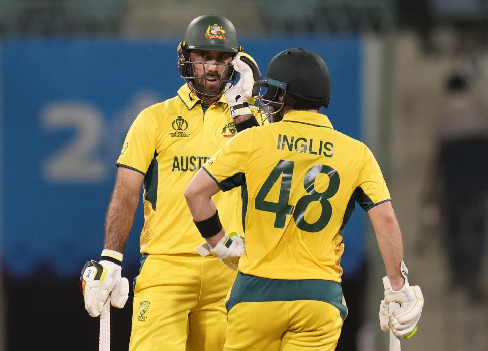 Australia's Glenn Maxwell talks to Josh Inglis after hitting a boundary during the ICC Men's Cricket World Cup match between Australia and Sri Lanka in Lucknow, India, Monday, Oct. 16, 2023. (AP Photo/Aijaz Rahi)