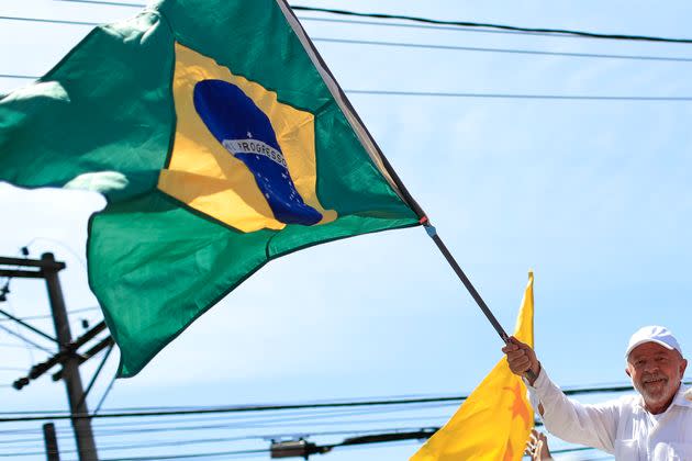 Brazil's president-elect, Luiz Inácio Lula da Silva, waves a Brazilian flag during a rally on Oct. 20, 2022, in São Gonçalo, Brazil. (Photo: Buda Mendes via Getty Images)