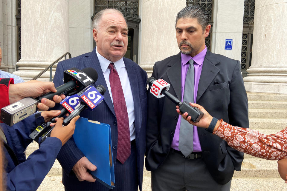 Derby, CT alderman and mayoral candidate Gino DiGiovanni, Jr.  and his attorney Martin Minnella appear outside New Haven federal court after DiGiovanni Jr.’s first appearance before a judge in connection with his Tuesday arrest on January 6th charges.” (David Mulligan / NBC News)