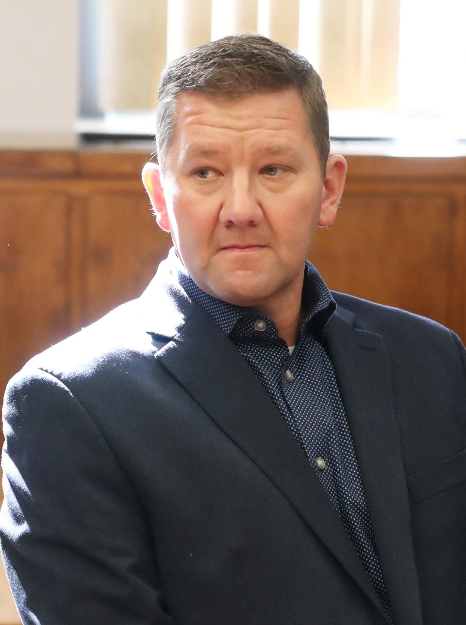 Former state Rep. Bob Young waits to hear the verdict in his bench trial in Barberton Municipal Court on Thursday. Young was found guilty of domestic violence and acquitted of assault by Visiting Judge Edward O'Farrell.