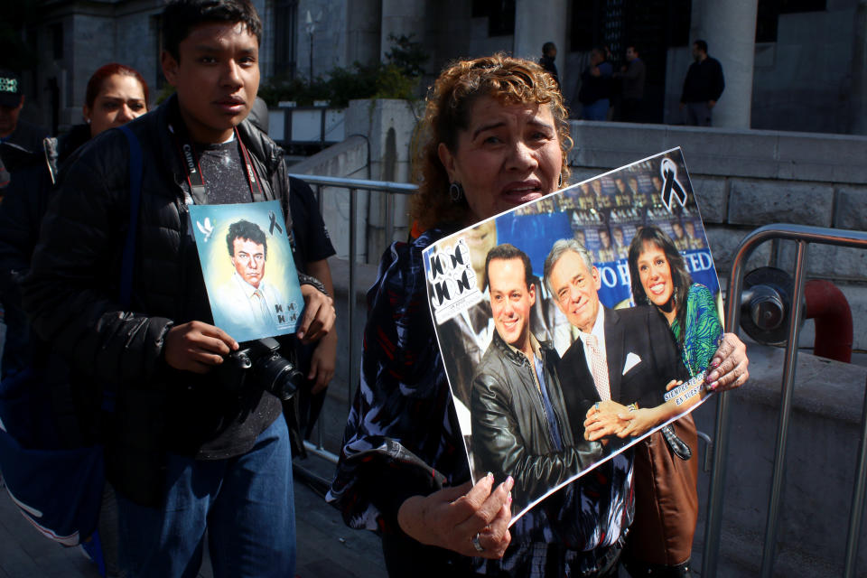 MEXICO CITY, MEXICO - OCTOBER 09: Fans hold pictures of José José during a tribute to the late Mexican singer Jose Jose at Palacio de Bellas Artes on October 9, 2019 in Mexico City, Mexico. Jose Romulo Sosa Ortiz (real name of Jose Jose) passed away September 28 in Miami after struggling with cancer. Known as 'El Principe de la Cancion', Jose Jose had a long career during the 70's and 80's reaching top of the charts many times. (Photo by Adrián Monroy/Medios y Media/Getty Images)