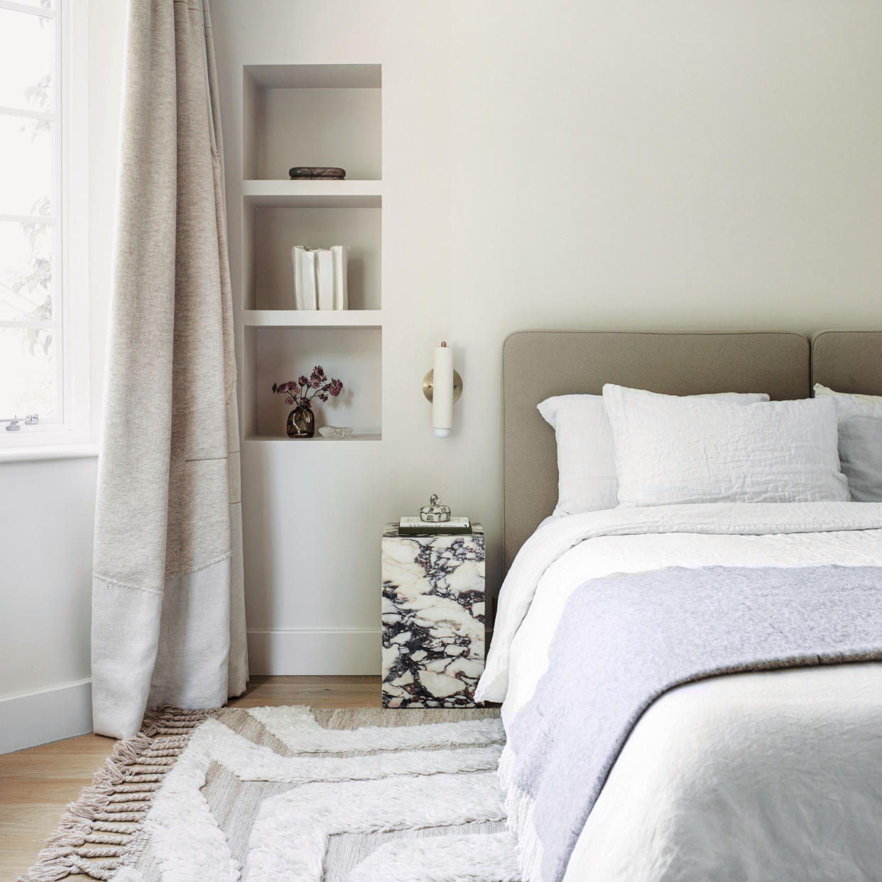  Neutral bedroom with marble bedside table 