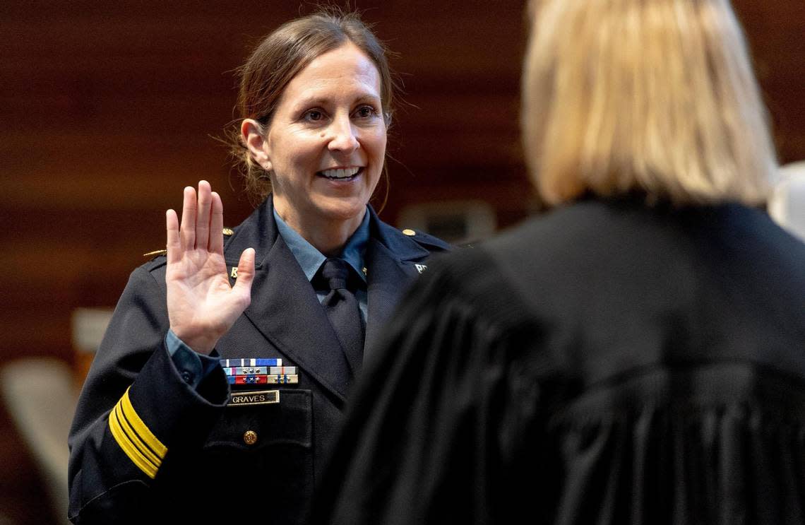 Stacey Graves, a 25-year Kansas City Police Department veteran, is sworn in as the department’s 48th police chief by Judge Jennifer M. Phillips at KCPD Headquarters on Thursday in Kansas City.