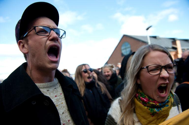 People shout outside the United Nations Intergovernmental Panel on Climate Change (IPCC) during a protest to demand immediate political action on the climate, September 27, 2013 in Stockholm