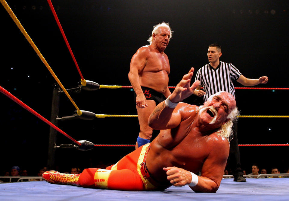 <p>Hulk Hogan grimaces in pain as his opponent Ric Flair stands over him during Hulk Hogan’s Hulkamania Tour at Rod Laver Arena on November 21, 2009 in Melbourne, Australia. (Photo by Mark Dadswell/Getty Images) </p>