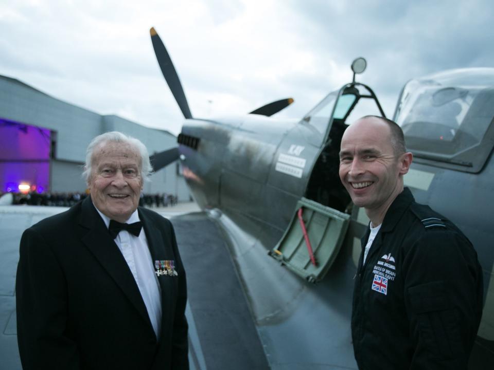 Geoffrey Wellum (left), has passed away aged 97. A veteran of the Battle of Britain, he is pictured talking about the Spitfire with Squadron Leader Mark Discombe at RAF Northolt: PA