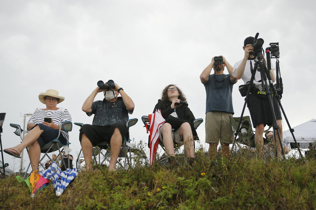 CAPE CANAVERAL, FLORIDA - MAY 27: Spectators wait for the launch of SpaceX Falcon 9 rocket, with the manned Crew Dragon spacecraft at the Kennedy Space Center, which NASA later scrubbed due to weather conditions on May 27, 2020 in Port Canaveral, Florida. NASA will try again on Saturday for the inaugural flight that will be the first manned mission since 2011 to be launched into space from the United States. (Photo by Michael Reaves/Getty Images)