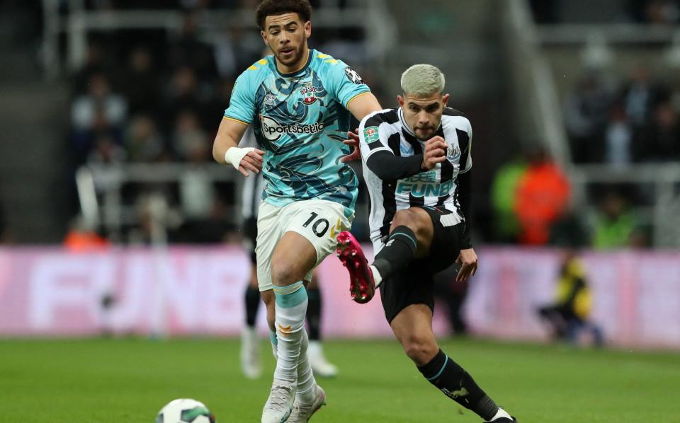 Newcastle United's Bruno Guimaraes in action with Southampton's Che Adams - Scott Heppell/Reuters