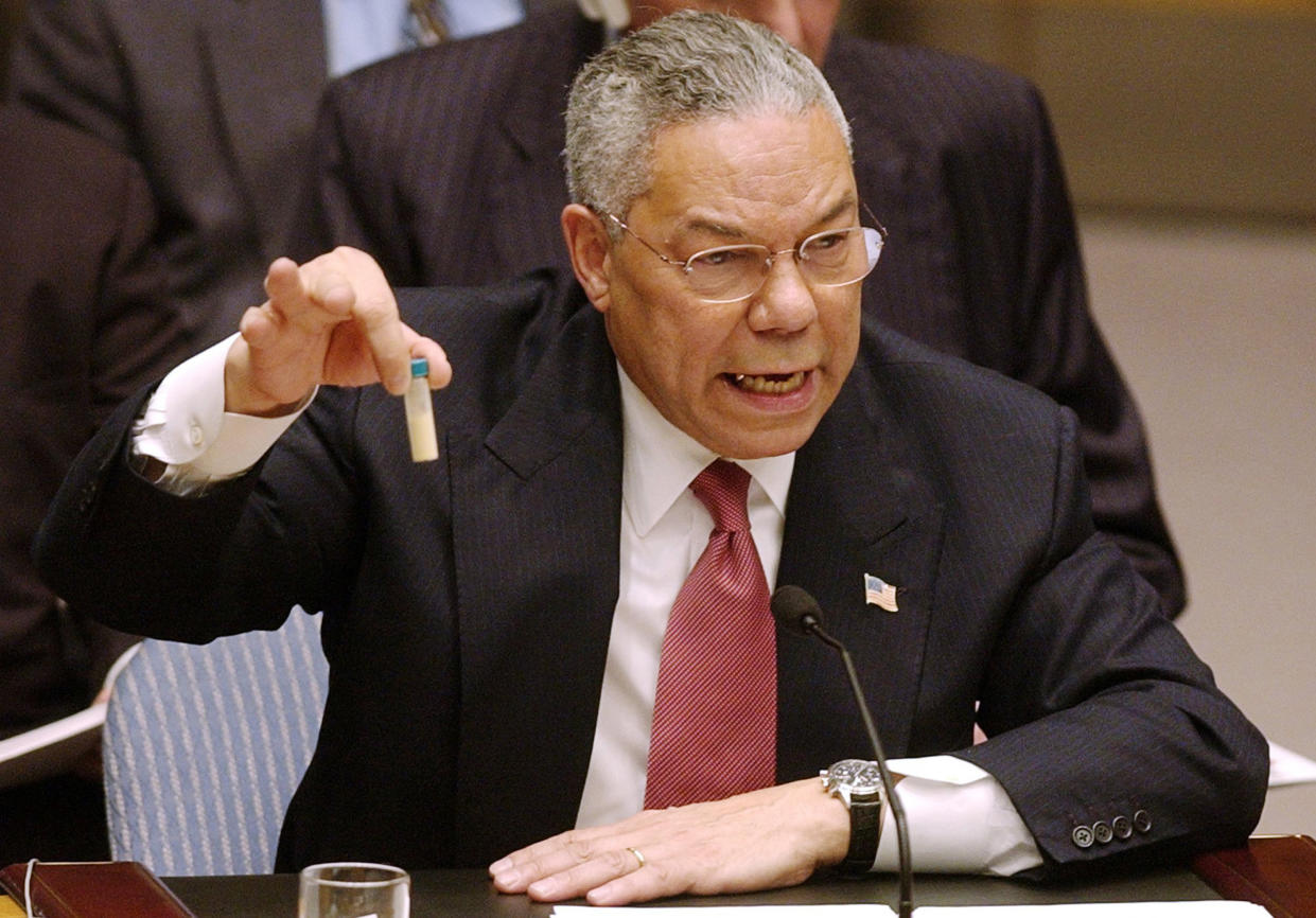 Secretary of State Colin Powell holds up a vial he said could contain anthrax as he presents evidence of Iraq's alleged weapons programs to the United Nations Security Council in this Feb. 5, 2003 file photo. (Elise Amendola / AP file)