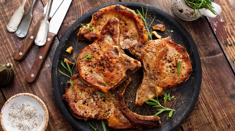 pork chops on black plate