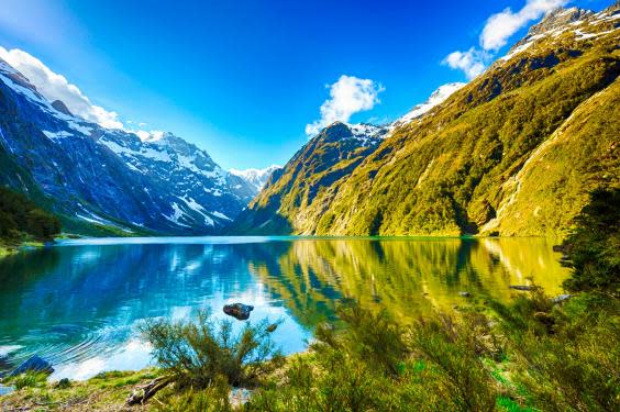 Darran Mountains reflecting in Lake Marian, New Zealand (istock)