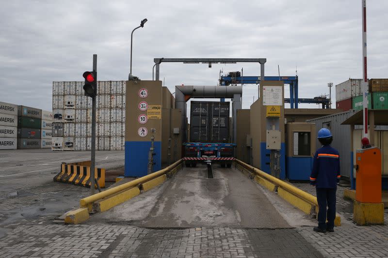 A truck carrying a container passes through the x-ray system as part of the inspection for the search for smuggled drugs at the Port of Santos in Santos