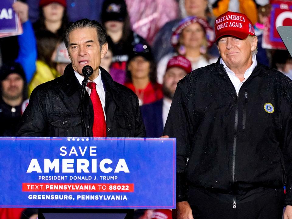 Pennsylvania Senate candidate Mehmet Oz, left, accompanied by former President Donald Trump, speaks at a campaign rally in Greensburg, Pa., Friday, May 6, 2022.