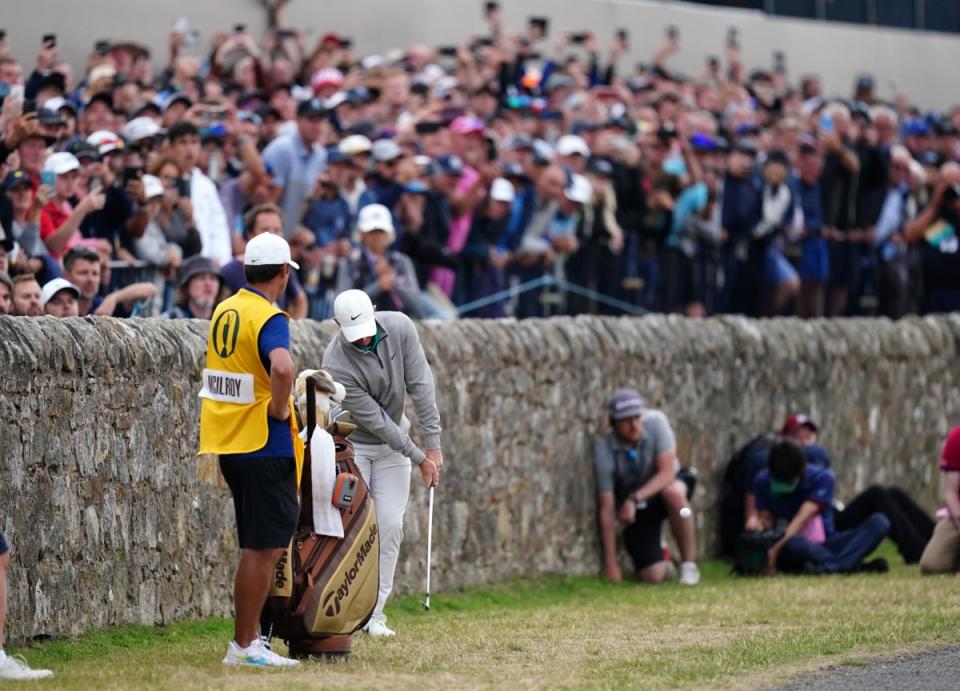 Rory McIlroy plays from close to the wall on the 17th hole during the third round of the 150th Open (David Davies/PA) (PA Wire)