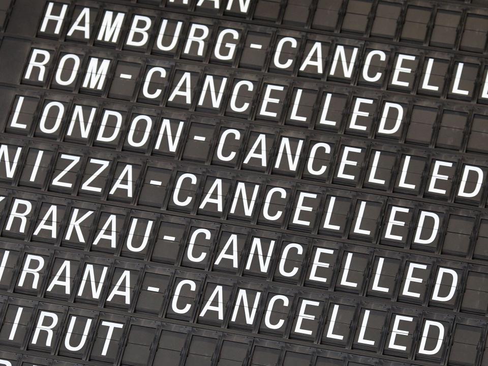 A display indicates cancelled flights at Frankfurt Airport in Frankfurt am Main, western Germany, on July 27, 2022, after employees of German airline Lufthansa were called to strike. - German national carrier Lufthansa said on July 26 it would have to cancel almost all flights at its domestic hubs in Frankfurt and Munich because of a planned strike by ground crew, adding to a summer of travel chaos across Europe.