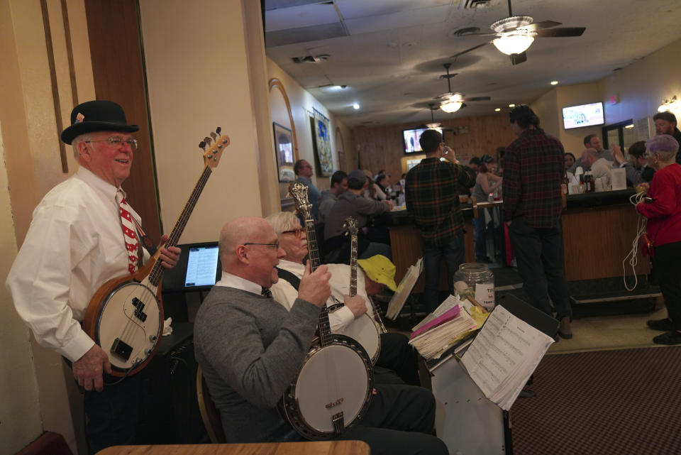 The Pittsburgh Banjo Club performs at the Allegheny Elks Lodge #339 on the first night of their annual fish fry in Pittsburgh, on Friday, Feb. 24, 2023. Fish fries have been a longtime Catholic tradition in Western Pennsylvania but increased in popularity in 1966 after the Second Vatican Council announced that not eating meat on Fridays was optional, except during Lent. Today they are held anywhere, from churches to fire stations to restaurants. (AP Photo/Jessie Wardarski)