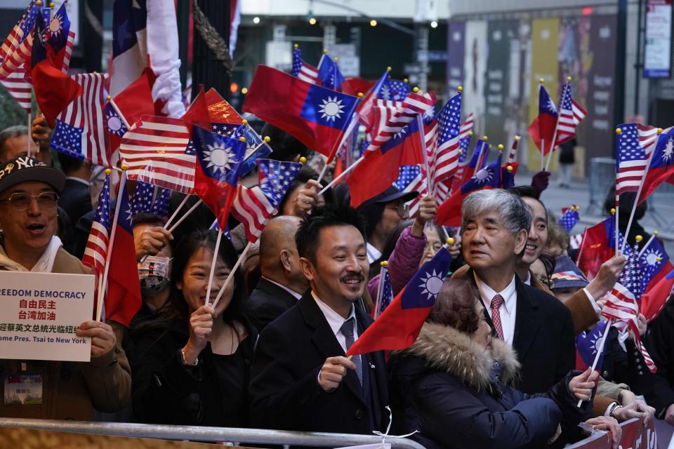 Supporters holding American and Taiwanese flags cheer as Taiwan's president, Tsai Ing-wen, arrives at her hotel in New York City on March 29.