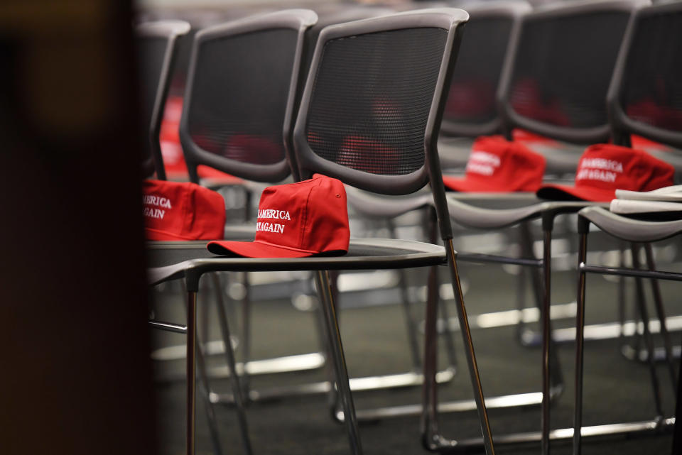 Make America Great Again hats sit on chairs before the start of a morning Republican event at the Capitol on Nov. 15, 2016.