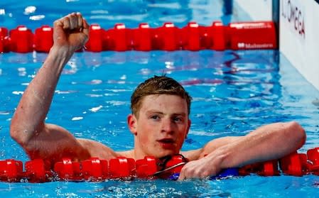 Adam Peaty of Britain reacts after winning the men's 50m breaststroke final at the Aquatics World Championships in Kazan, Russia August 5, 2015. REUTERS/Stefan Wermuth