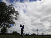 Jim Furyk of the U.S. hits an approach shot on the third hole during the final round of the BMW Championship golf tournament at the Conway Farms Golf Club in Lake Forest, Illinois, September 16, 2013. REUTERS/Jim Young