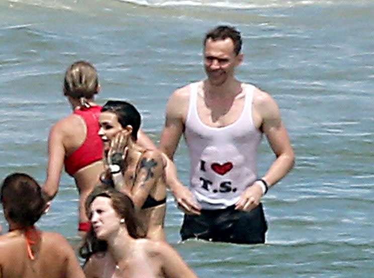 Tom Hiddleston made a splash with his tank top on the Fourth of July. (Photo: Splash News)