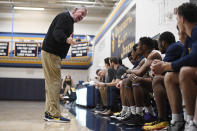 Saint Joseph coach Jim Calhoun talks to his team during the first half of an NCAA college basketball game against Pratt Institute, Friday, Jan. 10, 2020, in West Hartford, Conn. Now coaching Division III basketball with the same fire he stalked the sidelines at UConn, Calhoun is reaching his 900th win as a college coach. (AP Photo/Jessica Hill)