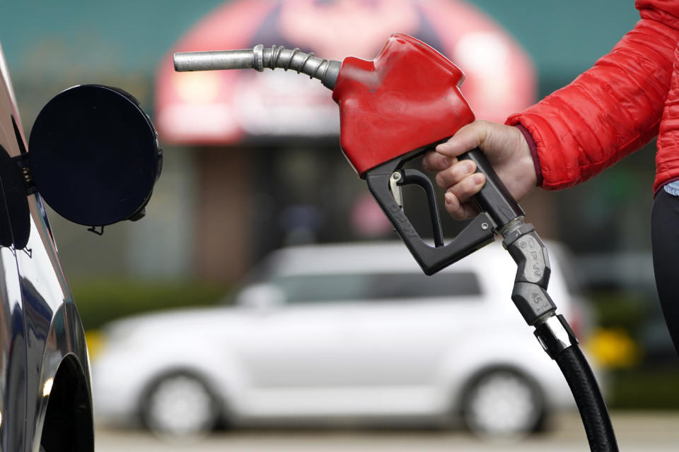 A motorist prepares to pump gas Thursday, April 22, 2021, in Portland, Maine. President Joe Biden committed the United States to cutting emissions by up to 52% by 2030 at a virtual Earth Day summit. (AP Photo/Robert F. Bukaty)