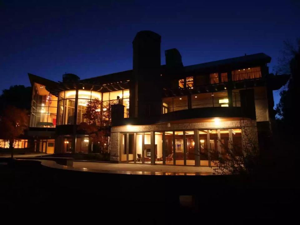 home shown at night with lights glowing in Iowa