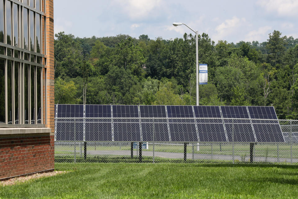 BLOOMSBURG, PENNSYLVANIA, UNITED STATES - 2023/07/15: Part of a ten acre solar panel array is seen on the campus of Central Columbia High School. Central Columbia School District installed a combination ground-mount and rooftop 3.8 megawatt array with nearly 7,000 bifacial solar panels which is estimated to offset 90% of the school district's annual power consumption. (Photo by Paul Weaver/SOPA Images/LightRocket via Getty Images)