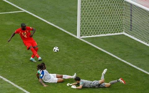 Torres slides in to toe the ball past the post and beyond Lukaku - Credit: AP Photo/Victor R. Caivano