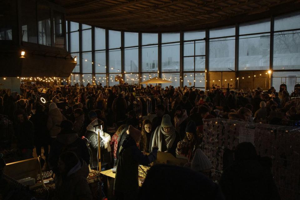 People visit a charity fair, organized to collect money for Ukraine's army, in the Zhytniy Market in Kyiv, on December 10, 2023, amid the Russian invasion of Ukraine. (Roman Pilipey /AFP via Getty Images)