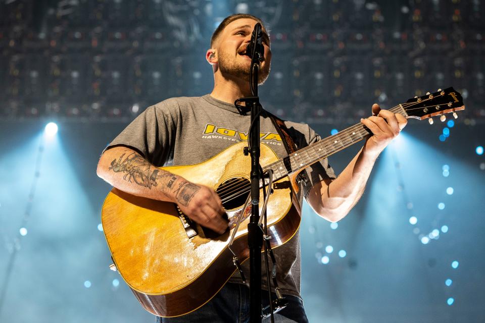 Zach Bryan wears an Iowa Hawkeyes Athletics T-Shirt while performing at Wells Fargo Arena on Thursday, April 25, 2024, in Des Moines.