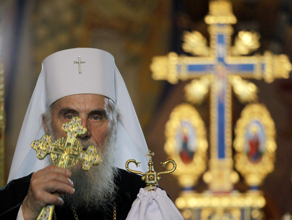 FILE - In this May 5, 2013, file photo, Serbian Orthodox Church Patriarch Irinej performs the traditional Orthodox Easter Liturgy in the St. Sava temple, in Belgrade, Serbia. The leader of the Serbian Orthodox Church, Patriarch Irinej, has died after testing positive for the coronavirus, the religious body said Friday, Nov. 20, 2020. He was 90.(AP Photo/Darko Vojinovic, File)