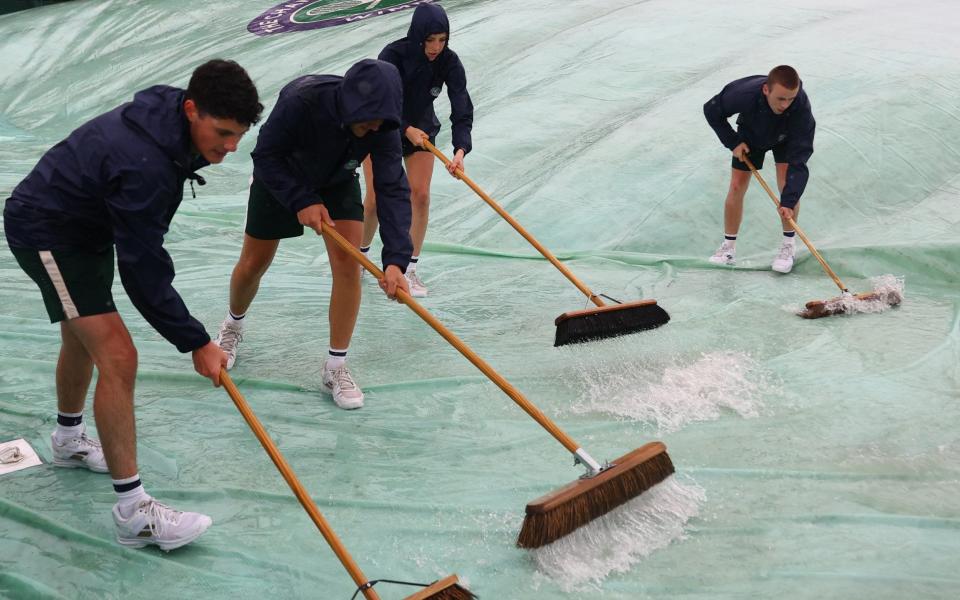 Wimbledon workers rain delay - Reuters/Hannah McKay