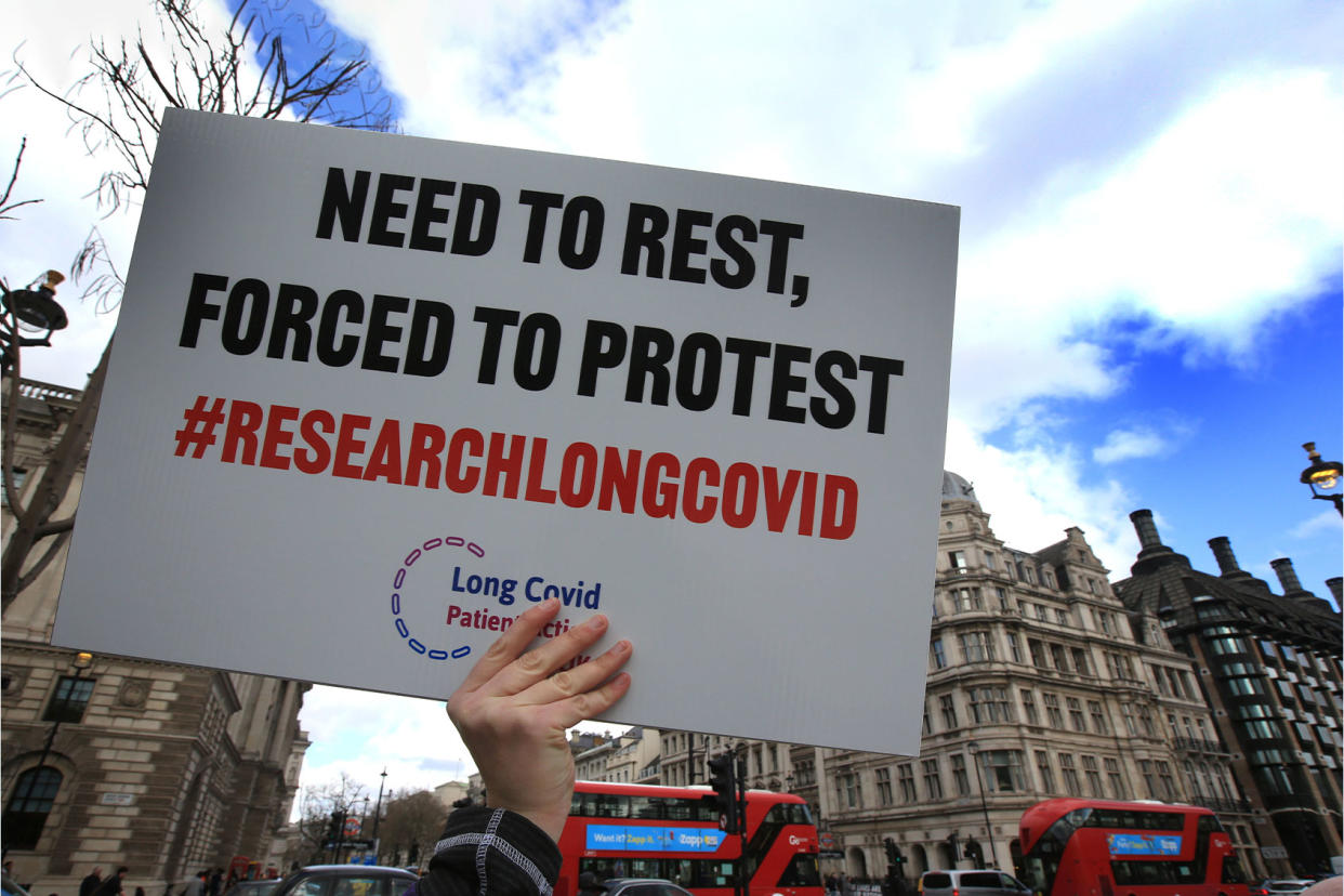 Research Long COVID protest sign Martin Pope/SOPA Images/LightRocket via Getty Images