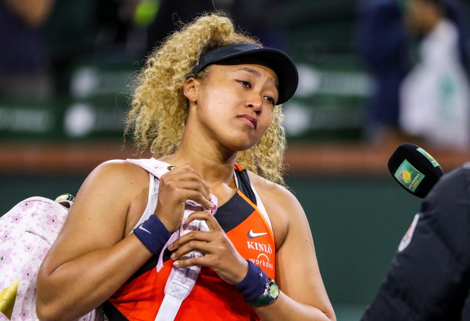 Naomi Osaka of Japan addresses the crowd about being heckled during her match against Veronika Kudermetova of Russia during round two of the BNP Paribas Open at the Indian Wells Tennis Garden in Indian Wells, Calif., Saturday, March 12, 2022. 