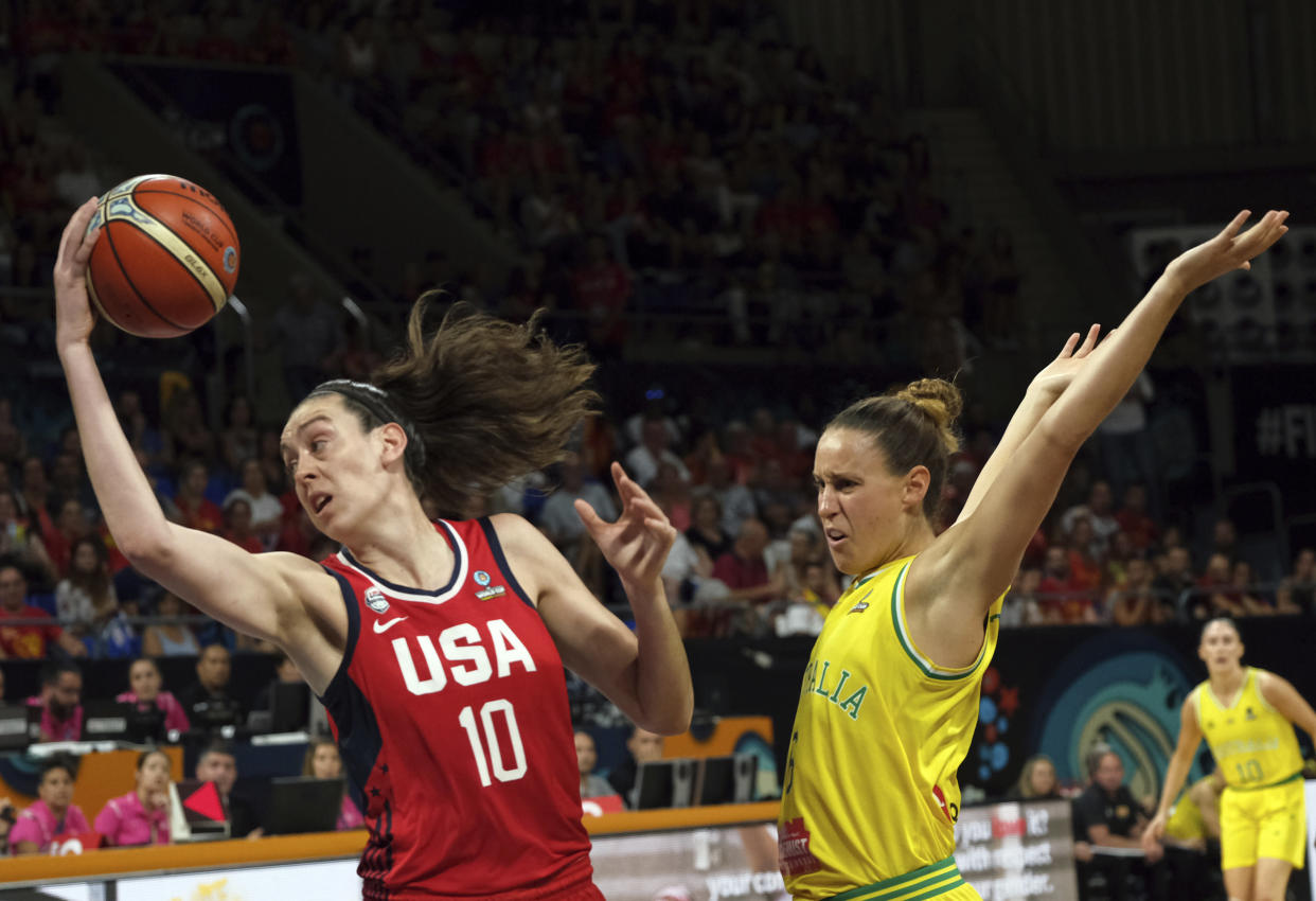 Breanna Stewart of the United States, left, jumps to shoot as Steph Talbot of Australia tries to stop her during the Women's basketball World Cup final match between Australia and the U.S.A. in Tenerife, Spain, Sunday Sept. 30, 2018. (AP Photo/Andres Gutierrez)