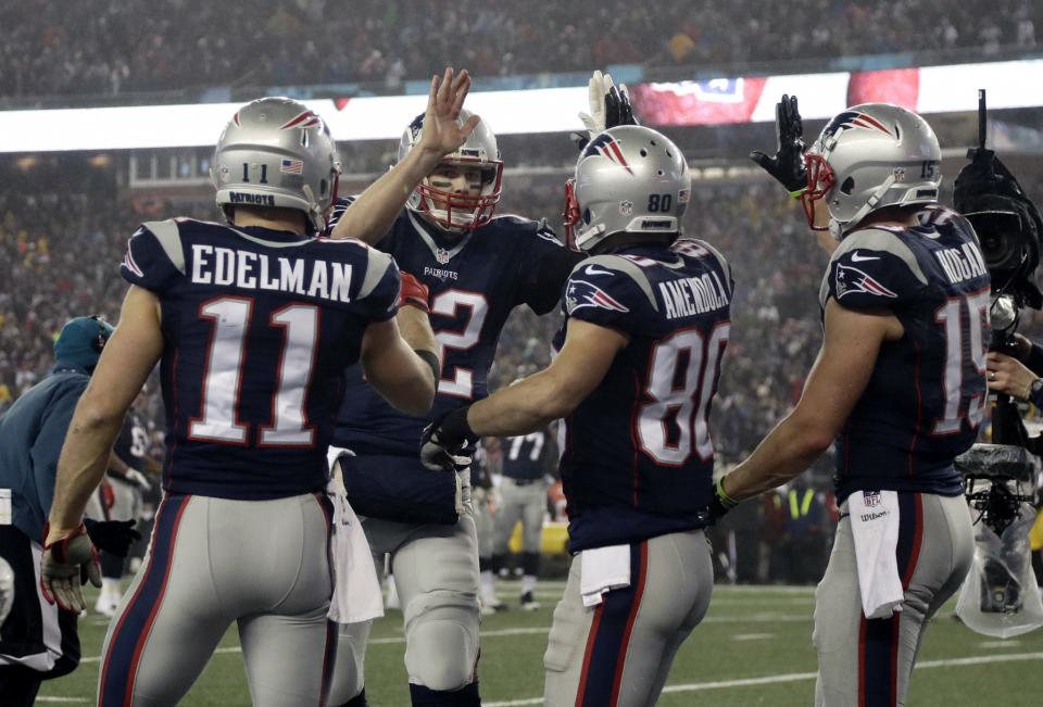 Tom Brady, center, says it’s up to his Patriots teammates whether they visit the White House. (AP)