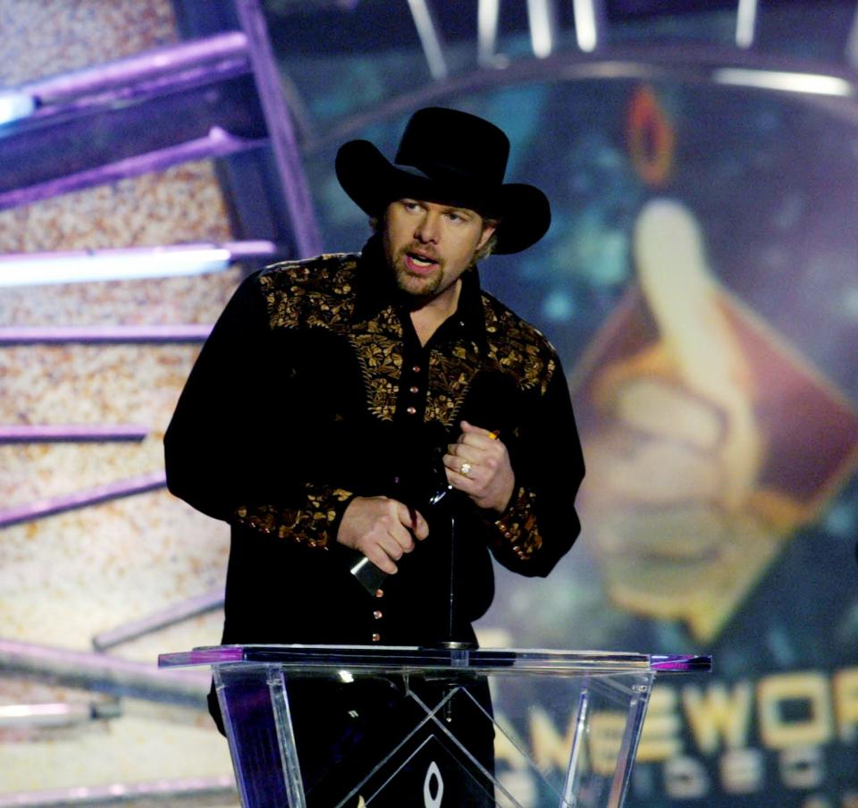 Co-host Toby Keith speaks after accepting one of three awards, including Video of the Year, for his “Courtesy of the Red, White & Blue (The Angry American)," during the CMT Flameworthy 2003 Video Music Awards show at the Gaylord Entertainment Center in Nashville on April 7, 2003.