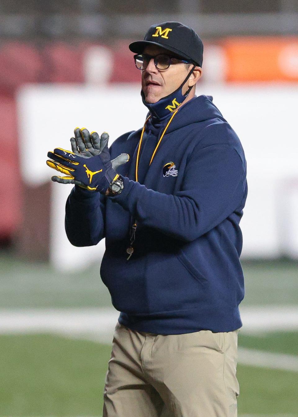 Michigan coach Jim Harbaugh looks on before the game against the Rutgers at SHI Stadium on Nov. 21, 2020.