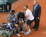 Tennis - French Open - Roland Garros - Latvia's Ernests Gulbis v Jo-Wilfried Tsonga - Paris, France - 28/05/16. Tsonga listens to medical staff. REUTERS/Jacky Naegelen