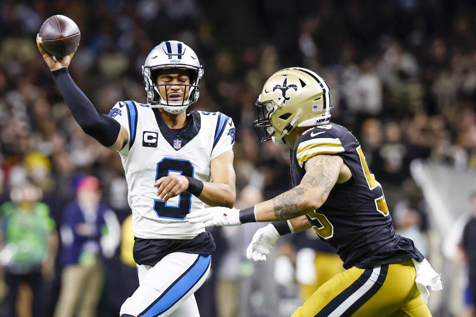 Carolina Panthers quarterback Bryce Young passes under pressure from New Orleans Saints linebacker D'Marco Jackson during the second half of an NFL football game in New Orleans, Sunday, Dec. 10, 2023. (AP Photo/Butch Dill)