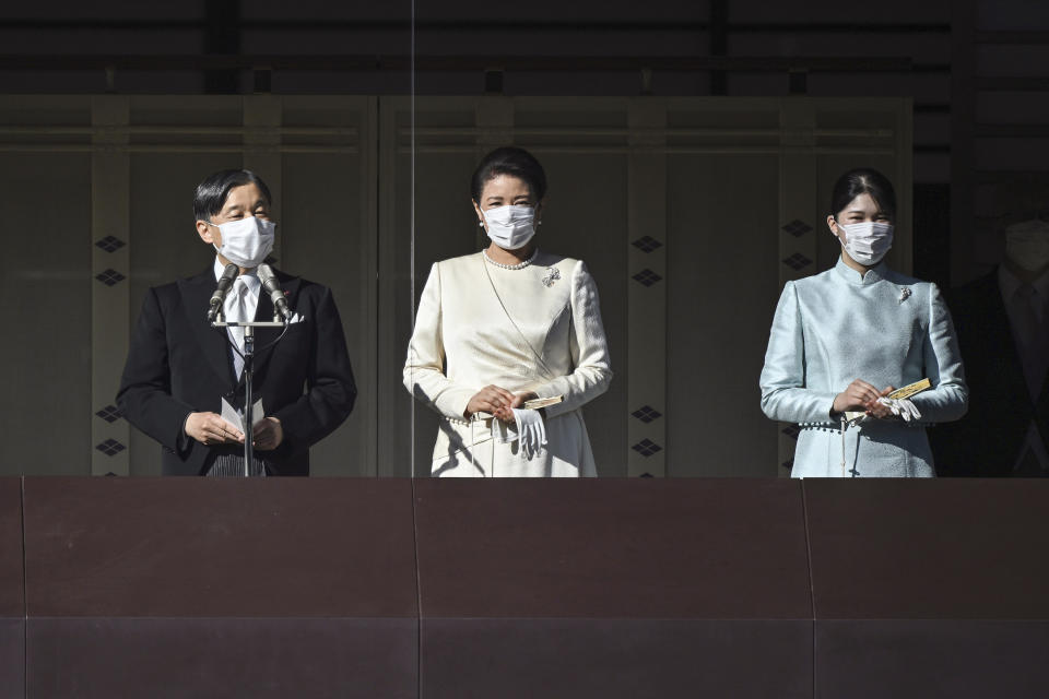 Japan's Emperor Naruhito gives a speech as Empress Masako and their daughter Princess Aiko, right, listen during the traditional New Year's greeting ceremony by Japan's royal family at the Imperial Palace in Tokyo Monday, Jan. 2, 2023. (Philip Fong/Pool Photo via AP)