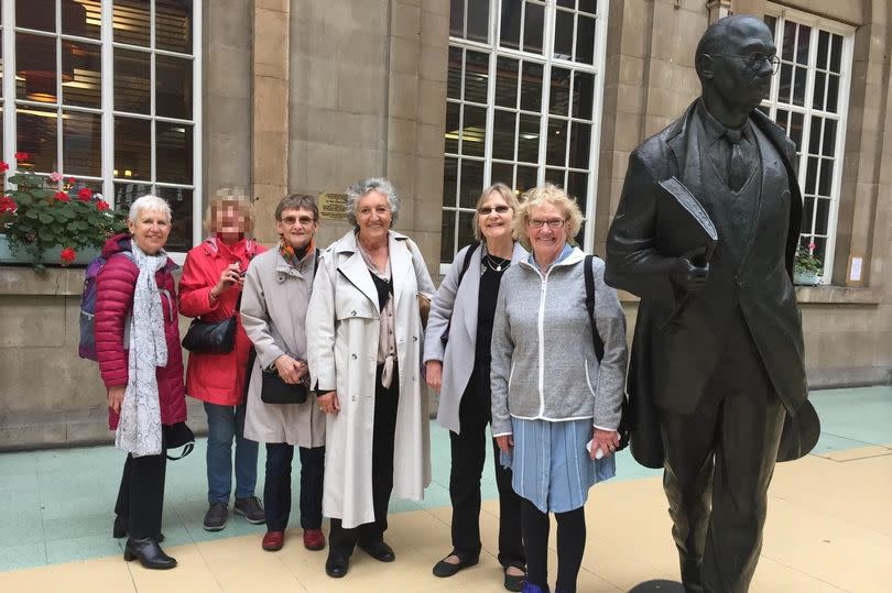 Sue Sykes and her University of Hull friends meet up by the Larkin statue at Hull Paragon Interchange as they celebrate a reunion