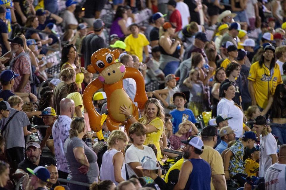 An inflatable monkey is sent around the crowd during one of the power outages during the Savannah Bananas World Tour on Saturday, July 29, 2023, at Sutter Health Park in West Sacramento.